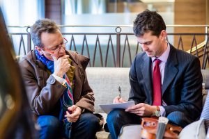 Amati specialist discussing a violin valuation with a client at a valuation day