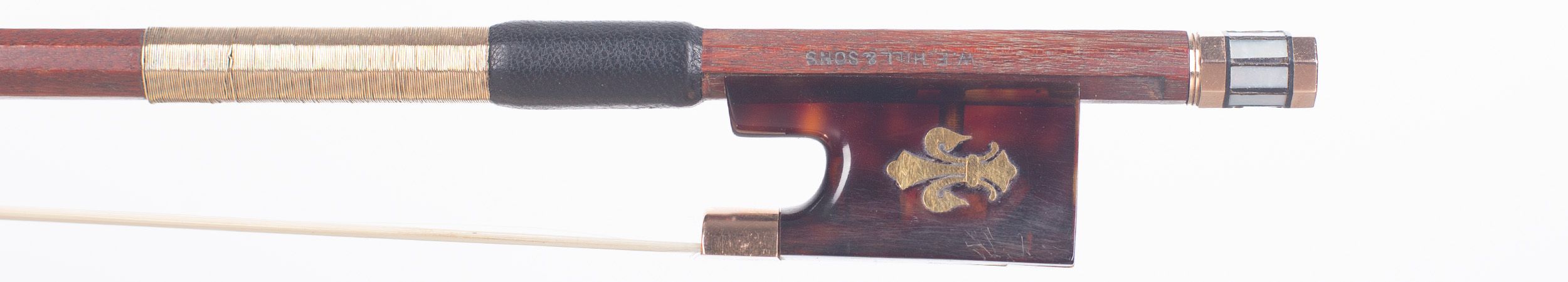 A gold-mounted violin bow by W. E. Hill & Sons, London — frog