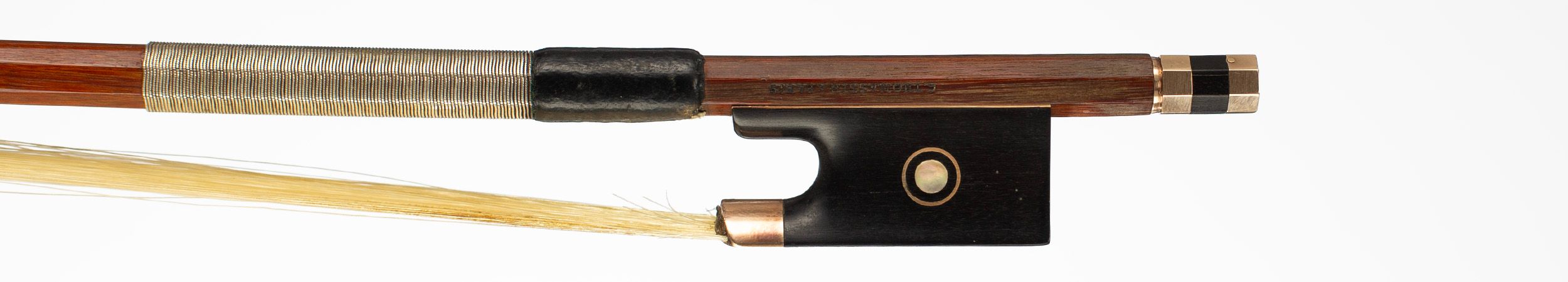 A gold-mounted violin bow, by Claude Thomassin, Paris, circa 1910 — frog
