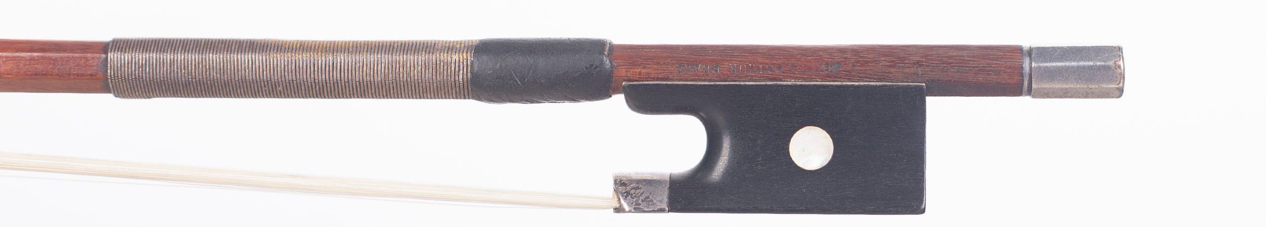 A silver-mounted violin bow by Claude Auguste Thomassin, Paris, circa 1920 — frog