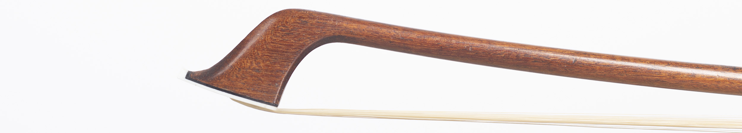 A nickel-mounted cello bow by Eugene Cuniot (Cuniot-Hury), France, 1910 — head