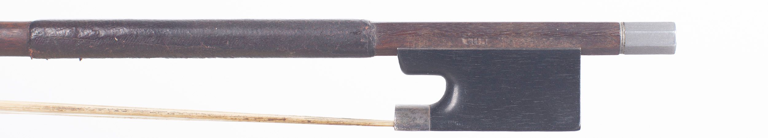 A silver-mounted violin bow by W. E. Hill & Sons, London — frog